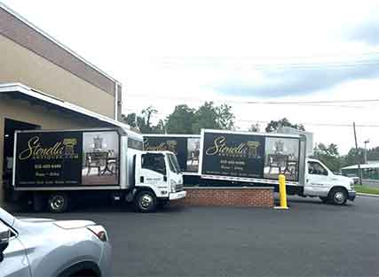 Stenella delivery trucks at a loading dock