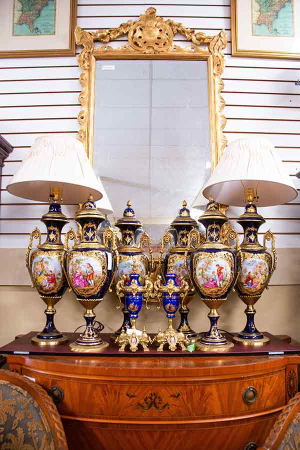 A display of antique lamps and mirror